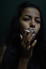 Sexy black woman smoking a cigarette
