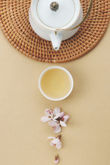 Obraz na płótnie Canvas Tea and flowers on the table