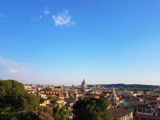 Obraz premium Scenic panorama of the historical center of Rome. Ancient city of Roma from above on a sunny day. Nice Rome scenery in summer.