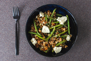 healthy plant-based food, crumbed hash brown with green beans and homemade vegan mozzarella made of cashews