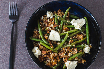 healthy plant-based food, crumbed hash brown with green beans and homemade vegan mozzarella made of cashews