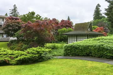 Paved pathway over small park in residential area