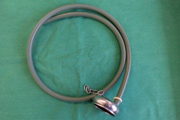 on  green surgical drape lies a suction cup for the birth