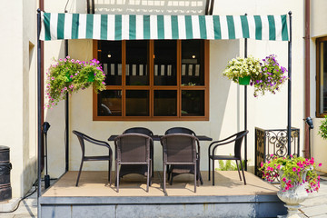 Outdoor rattan garden furniture with canopy to prevent sunlight.