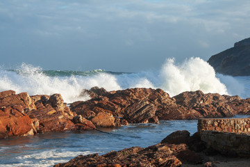 Waves breaking against the rocks