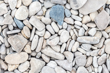Smooth pebbles close-up on the sea coast