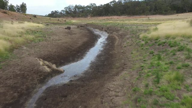 Aerial footage of a drought affected fresh water reservoir in regional Australia