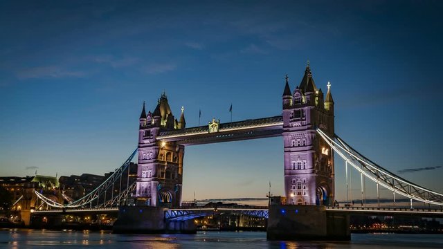 British landmarks and a new beginning concept with time lapse of the sunrise over the iconic Tower Bridge from across the River Thames in London, England, UK