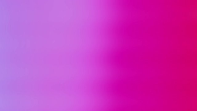 Soft color gradient motion background in purple pink red and orange with a smooth moving modern style. High definition 4k video modern backdrop with a fading gradient color and one minute length.