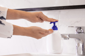 Women washing hands with antibacterial soap sanitizer or alcohol gel for corona covid-19 virus prevention. Hygiene to stop spreading of germs and bacteria and avoid infections corona covid-19 virus.