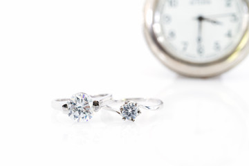 Diamond gem wedding rings with watch on white
