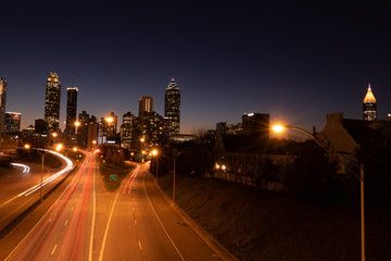 Fototapeta na wymiar car trails at night in city skyline