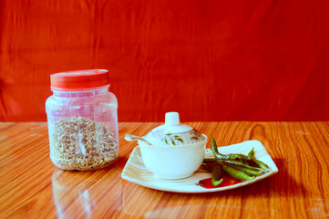 Mirch Marsala Green Chillies recipe. Food and drink. Health care and medical nutrition supplement. Ayurveda Herbal Home remedies. Healthy lifestyles. Red background.