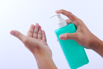 Man wash their hands with alcohol gel to prevent the spread of infections corona virus along with avoiding bacteria. Isolation on white background with clipping path.