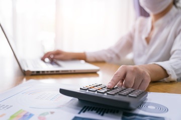 Closeup shot of woman using a laptop while working from home.