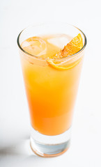 Fresh cocktail with vodka and orange juice on the rustic background. Selective focus. Shallow depth of field.