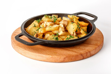 Chips with mushrooms on a cast-iron skillet on a wooden tray Isolated on a white background.