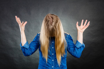 Furious woman making hands gestures.