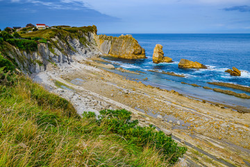 Amazing coast with incredible cliffs near the village of Liencres. Cantabria. Northern coast of Spain