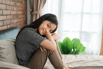 smiling young teen girl wake up in the bed