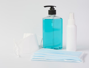 Coronavirus germ protective with blue mask  and gel alcohol or hand sanitizer  spray bottle for washing hand  to protect corona virus set on white background