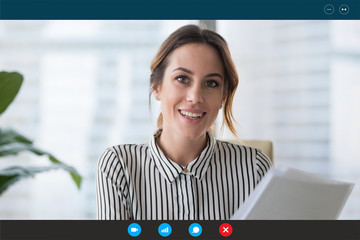 Headshot portrait screen view of young businesswoman consult client online using Webcam conference,...