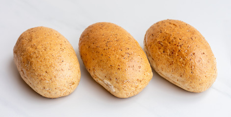 Three graham buns. Bakery products.