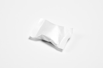 Blank packaging Candy plastic sachet isolated on white background.Candy wrapper Mock-up,Сan be used for design and branding.High resolution photo.