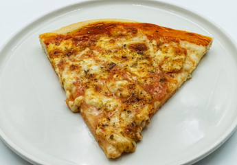 A slice of homemade italian margherita pizza