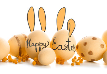 Beautiful Easter eggs with drawn bunny ears on white background