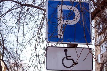 The road sign parking is allowed for disabled people