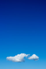 white cloud floating on clear blue sky