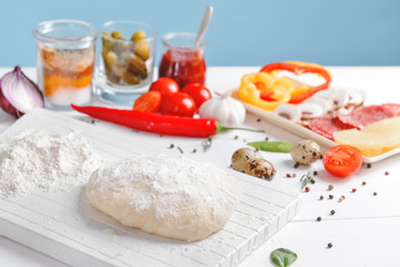 Ingredients for tasty pizza on table