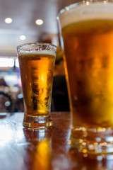 Glasses of light beer on the table