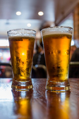 Glasses of light beer on the table