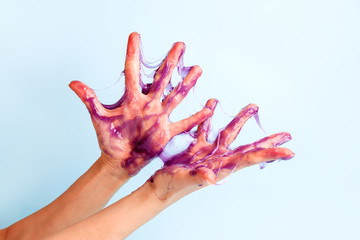 Sweet caramel paste for sugaring purple color on female hand, touch sensative creative idea, hair...