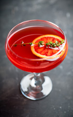 Blood oranges margarita on the rustic background. Selective focus. Shallow depth of field. © maxandrew