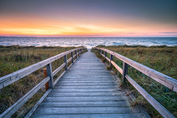 Naklejka na ściany i meble Wooden walkway along the beach, North Sea coast, Germany