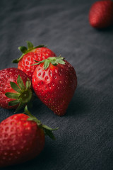 Close up of a fresh strawberries with leaves and selective focus.