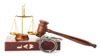 Judge's gavel, scales of justice, book and handcuffs on white background