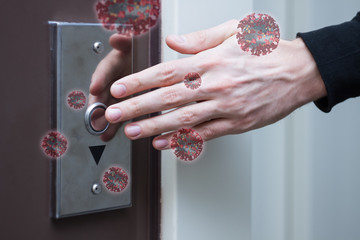 Closeup male hand is pressing elevator call button. Virus SARS-CoV-2 , 2019-nCoV are in air around,...
