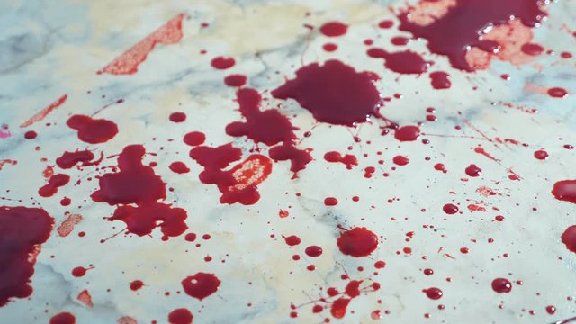 closeup. blood drips to the floor. a pool of blood on the floor