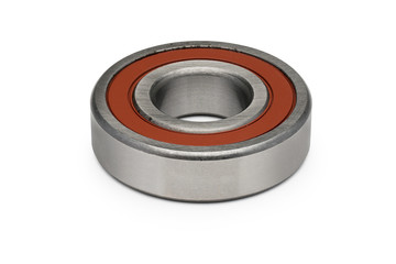 Isolate. Metal ball bearing with a red ring. Close-up. White background. Horizontal view.