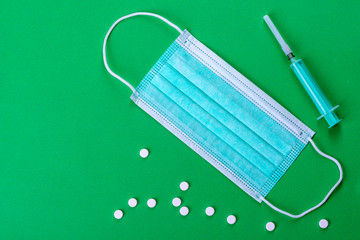Medical supplies on a colored background as an attribute of the fight against coronavirus