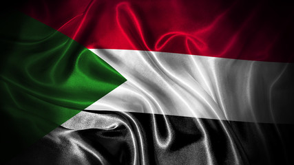 Close up waving flag of Sudan. National Sudan flag.