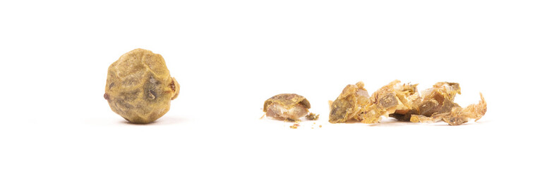 Whole peper next to a crushed one - Green