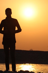 silhouette of man on background of sunset