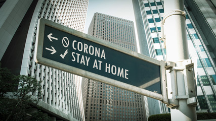 Obraz premium Street Sign STAY AT HOME