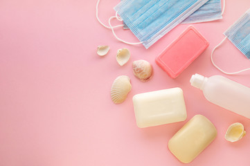 Soap with protective masks on a pink background