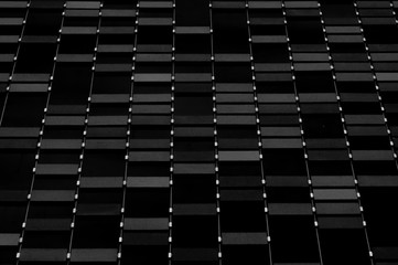 Abstract monochrome of straight geometric shape decoration with dark black & white background in the daylight